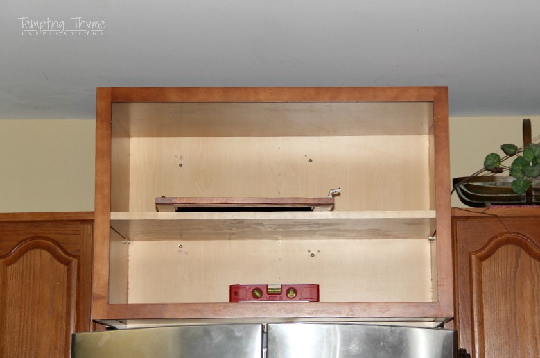 Installing a refrigerator cabinet not only gives you more storage space, but can make your kitchen look more customized.