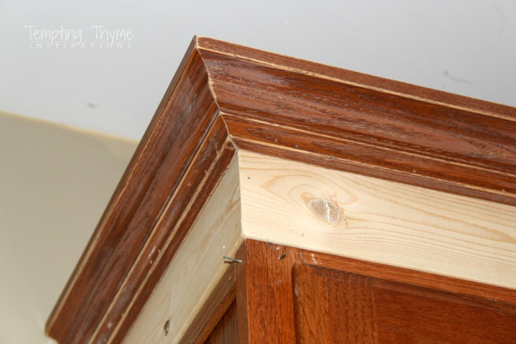 Beefing up the kitchen cabinets with simple molding