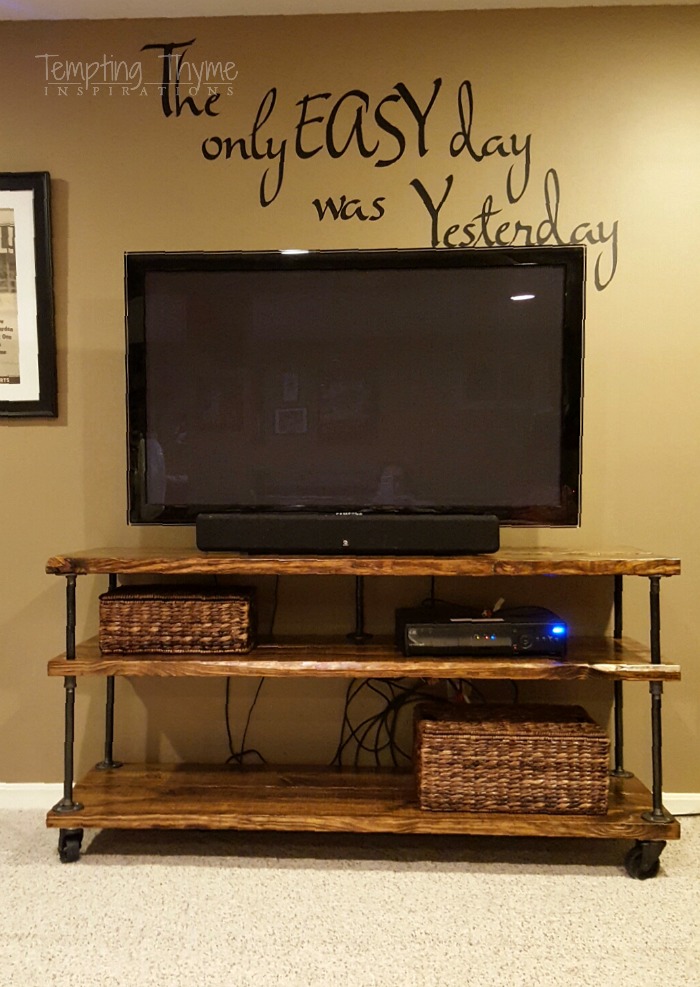 Quick and easy industrial tv cart using pipes, chunky wood and caster wheels.