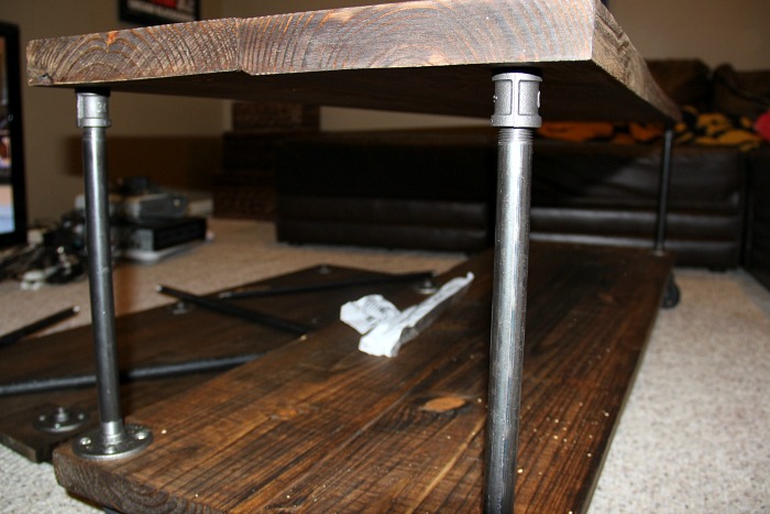 Quick and easy industrial tv cart using pipes, chunky wood and caster wheels.